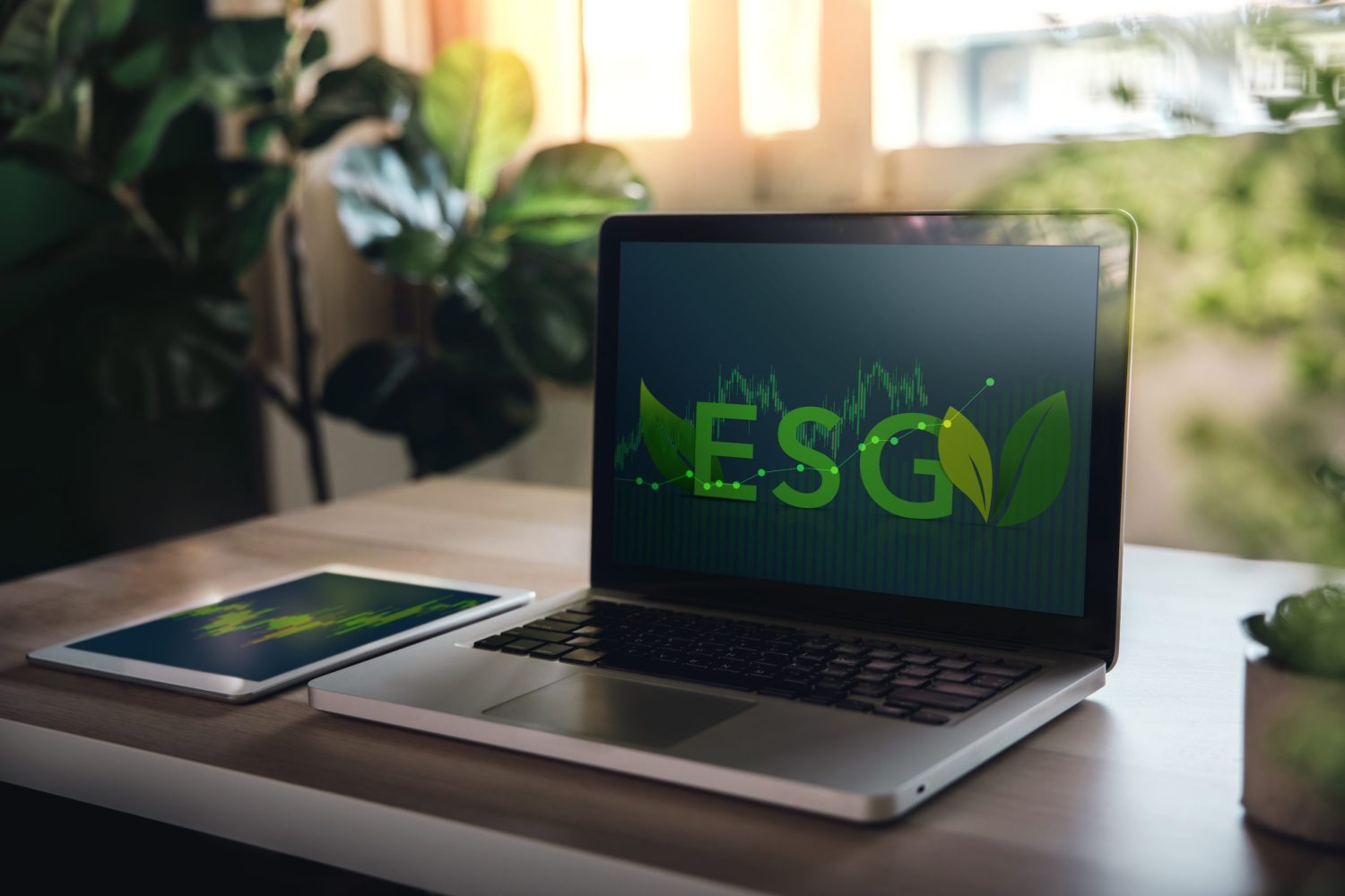 ESG, Ecology Care Concept. Environmental, Social and Corporate Governance. Businessman Planing an ESG Project on Laptop and Tablet. Green Energy, Renewable and Sustainable Resources